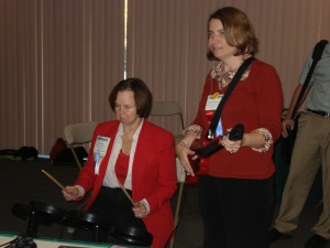 Jan Wilbur, Past President of NELA, tries her hand at Rock Band
